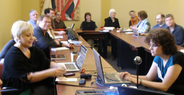 APOP's Évelyne Granger (right) moderates the online version of the proceeding as Paulette Cake and other participants listen raptly to the presentation.